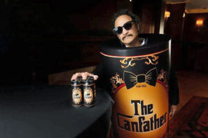 The Canfather holding cans